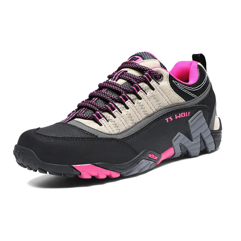 Black and gray TS Wolf hiking shoe with pink accents, durable sole, and padded collar