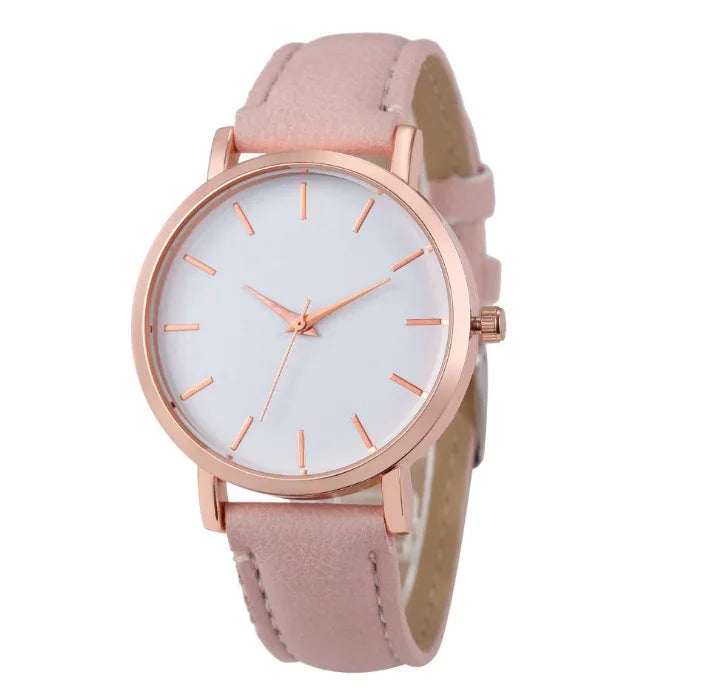 Elegant rose gold wristwatch with minimalist white dial and soft pink leather strap