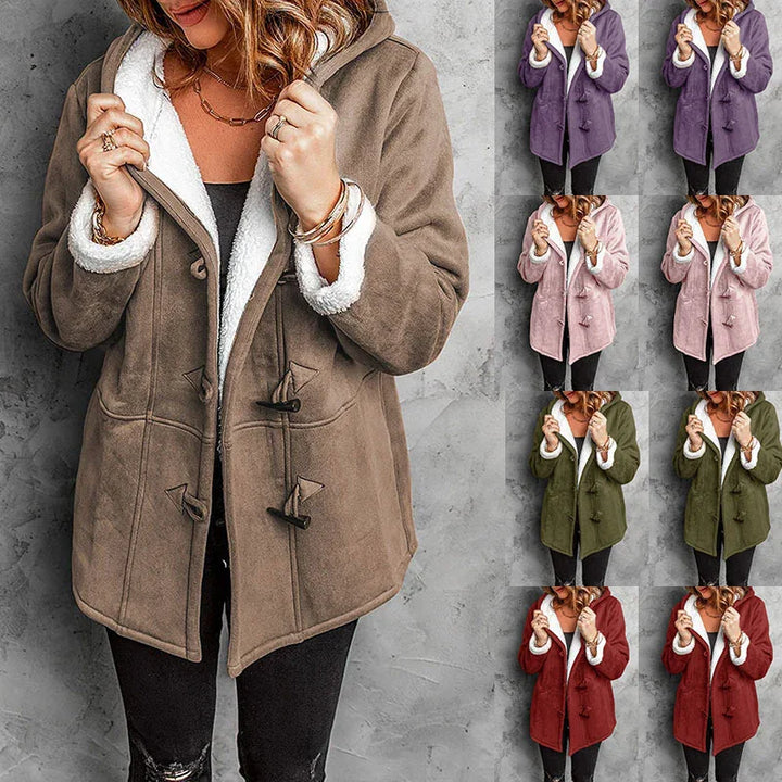 Woman wearing cozy toggle closure hooded sherpa jacket in multiple colors against gray background