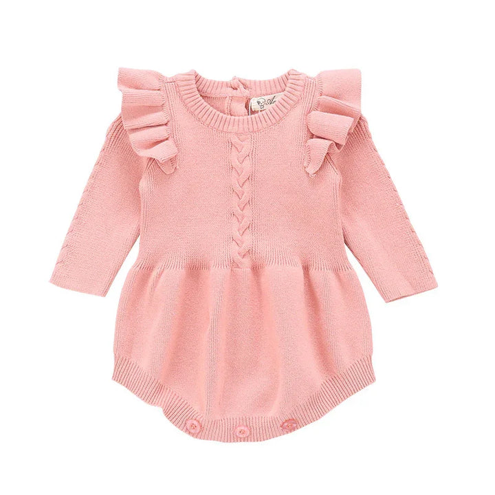 Pink knitted baby romper with long sleeves, ruffled shoulders, and buttoned bottom