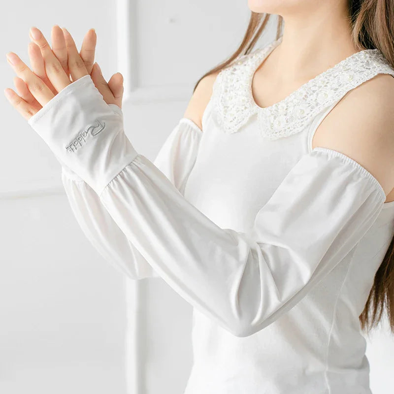 Woman wearing white cold shoulder top with lace collar and long fingerless gloves