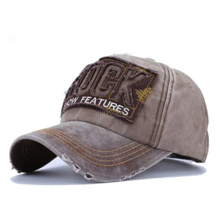 Distressed brown baseball cap with yellow stitching and embroidered patch reading 'LUCK' and 'SHOW FEATURES'