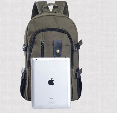 olive green backpack with multiple pockets holding an Apple iPad against a light background