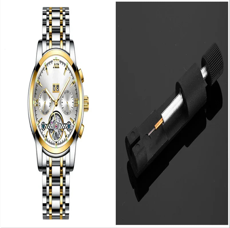 Luxury silver and gold wristwatch with white dial and chronograph next to a small black watch repair tool