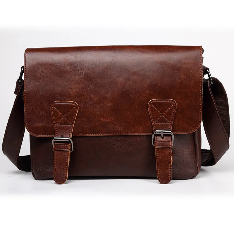 brown leather messenger bag with front buckles and adjustable shoulder strap on white background