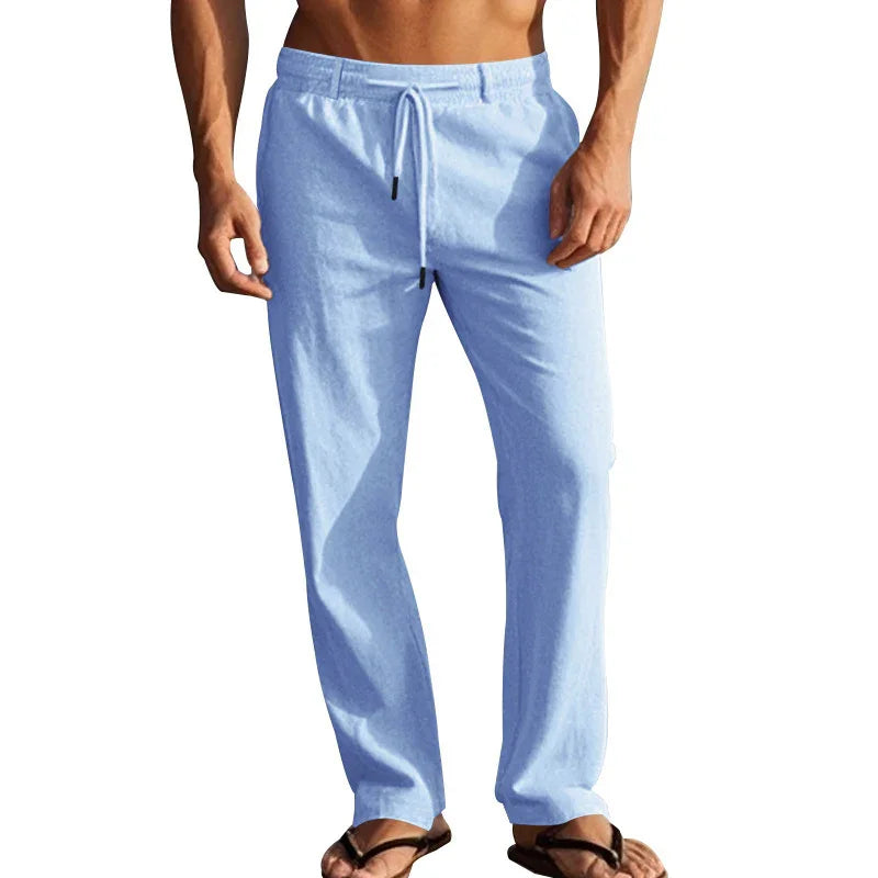 Men's light blue casual lounge pants with drawstring waist and relaxed fit, worn with sandals