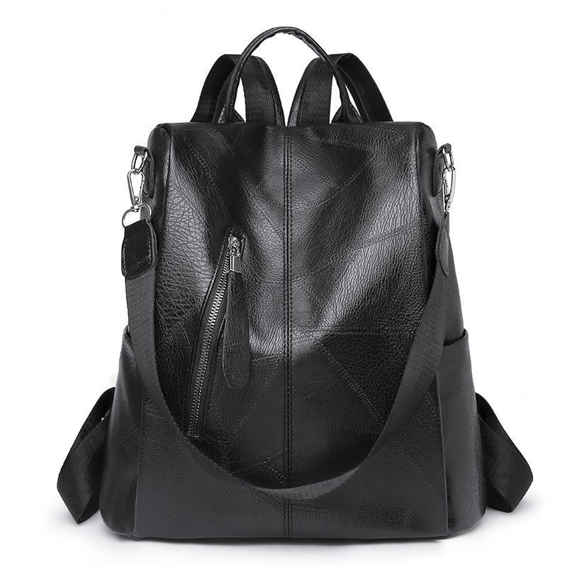 Black leather backpack with front zip pocket, adjustable straps, and top handle