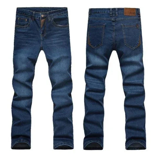 Front and back view of slim fit blue denim jeans with pockets and brown leather patch