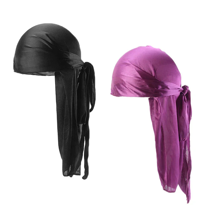 Black and purple satin durags with long tails tied at the back on white background