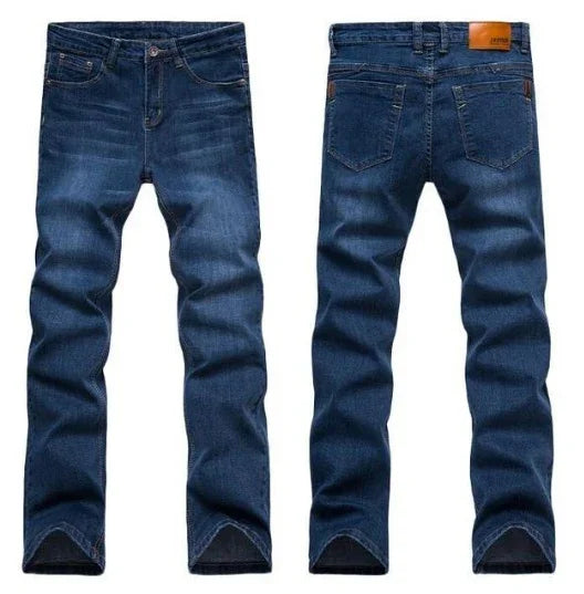 Front and back views of classic dark blue denim jeans with five-pocket design and leather patch