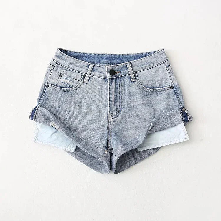 Light blue denim high-waisted shorts with rolled cuffs and front pockets on white background