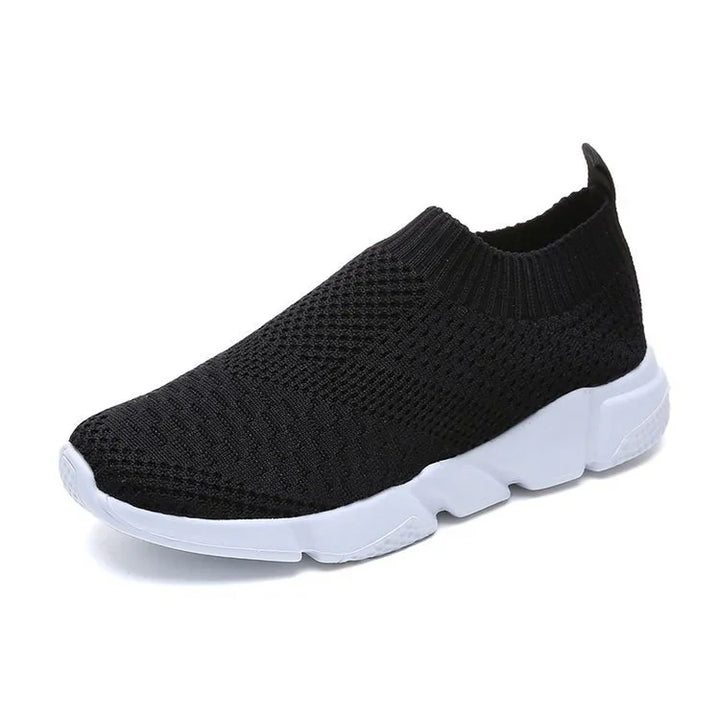 Black knit slip-on sneaker with white thick sole, breathable and flexible design