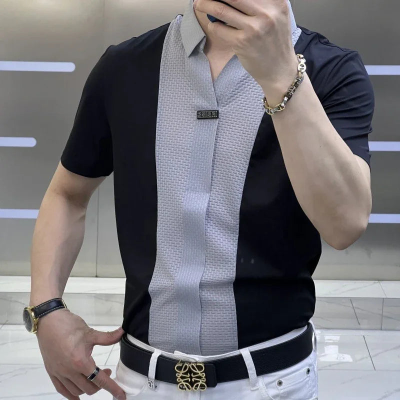 Man wearing black and gray textured short-sleeve shirt with white pants and black belt with gold buckle