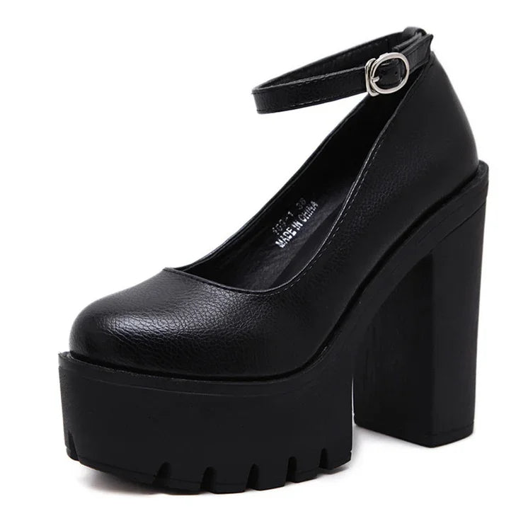 Black chunky platform heel shoe with ankle strap and silver buckle, textured leather finish