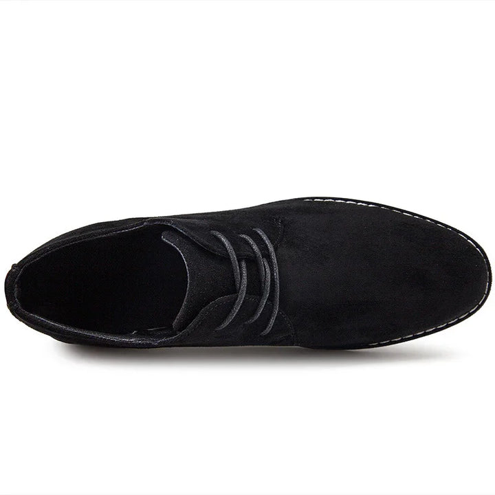 black suede men's dress shoe with laces and white stitched sole top view