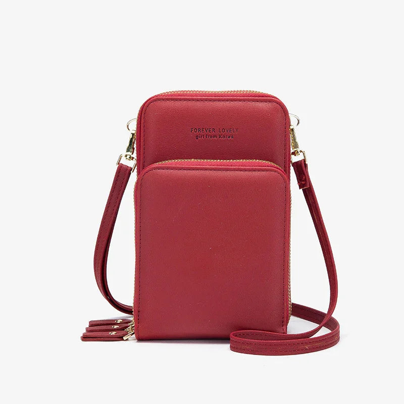 Red compact crossbody bag with double zippered compartments and adjustable strap