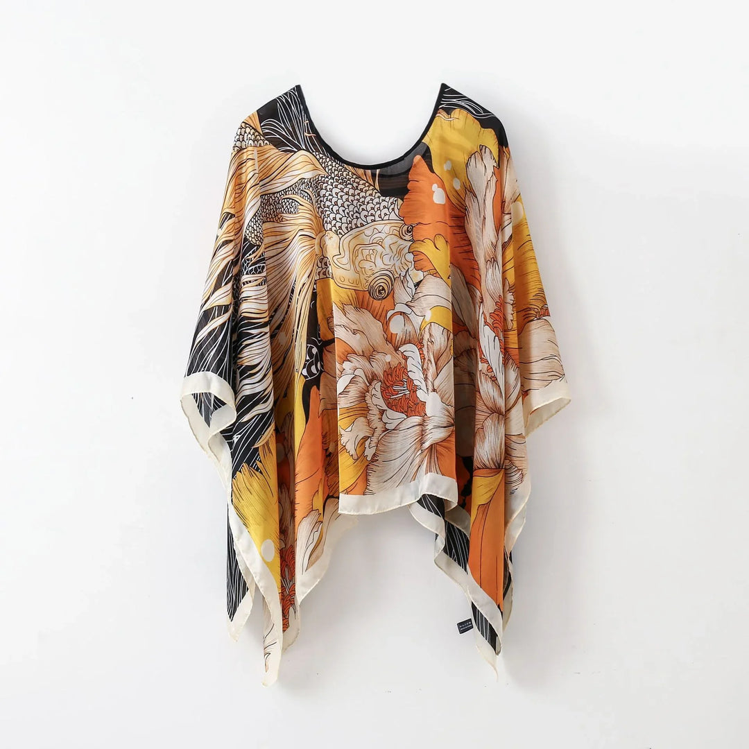 silk floral kaftan top with orange yellow black and white colors and intricate patterns