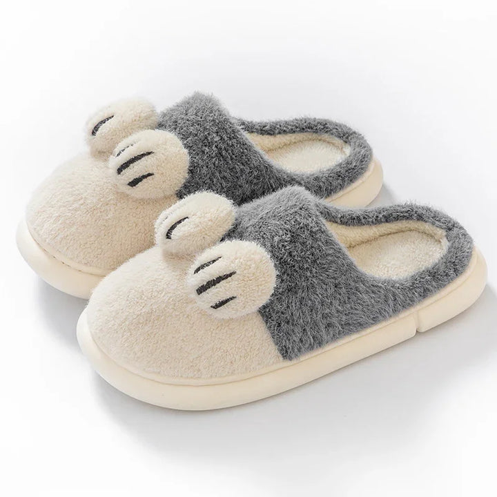 Cozy fuzzy slip-on slippers in beige and gray with adorable paw-shaped decorations