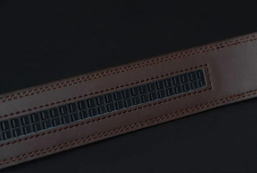 Close-up of brown leather belt with textured black rubber grip insert on black background