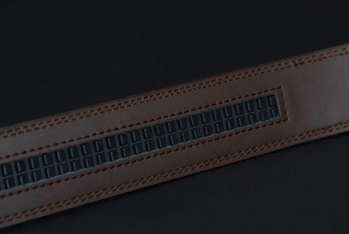 Close-up of brown leather belt with textured black rubber grip insert on black background