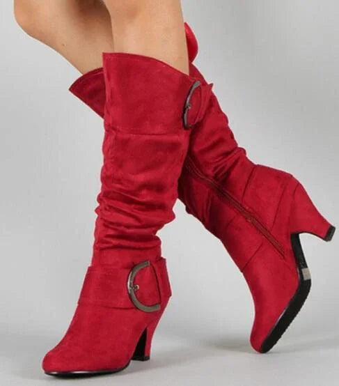 Women's mid-calf red suede boots with slouchy design, side zipper, and decorative buckle detail