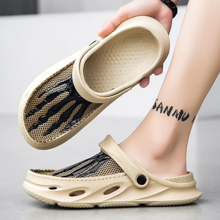 Beige casual slip-on shoes with black claw design, breathable mesh, worn on foot with ankle tattoo
