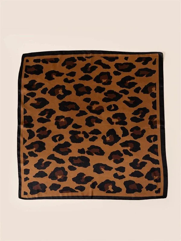 Square leopard print scarf with black border on beige background