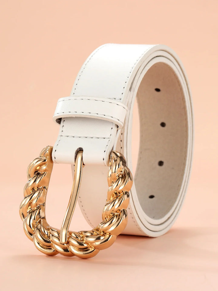 White leather belt with chunky braided gold buckle on peach background