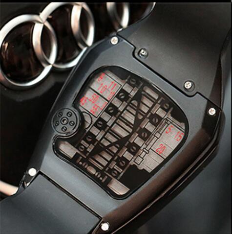 Close-up of digital wristwatch display with schematic design and Audi logo in background
