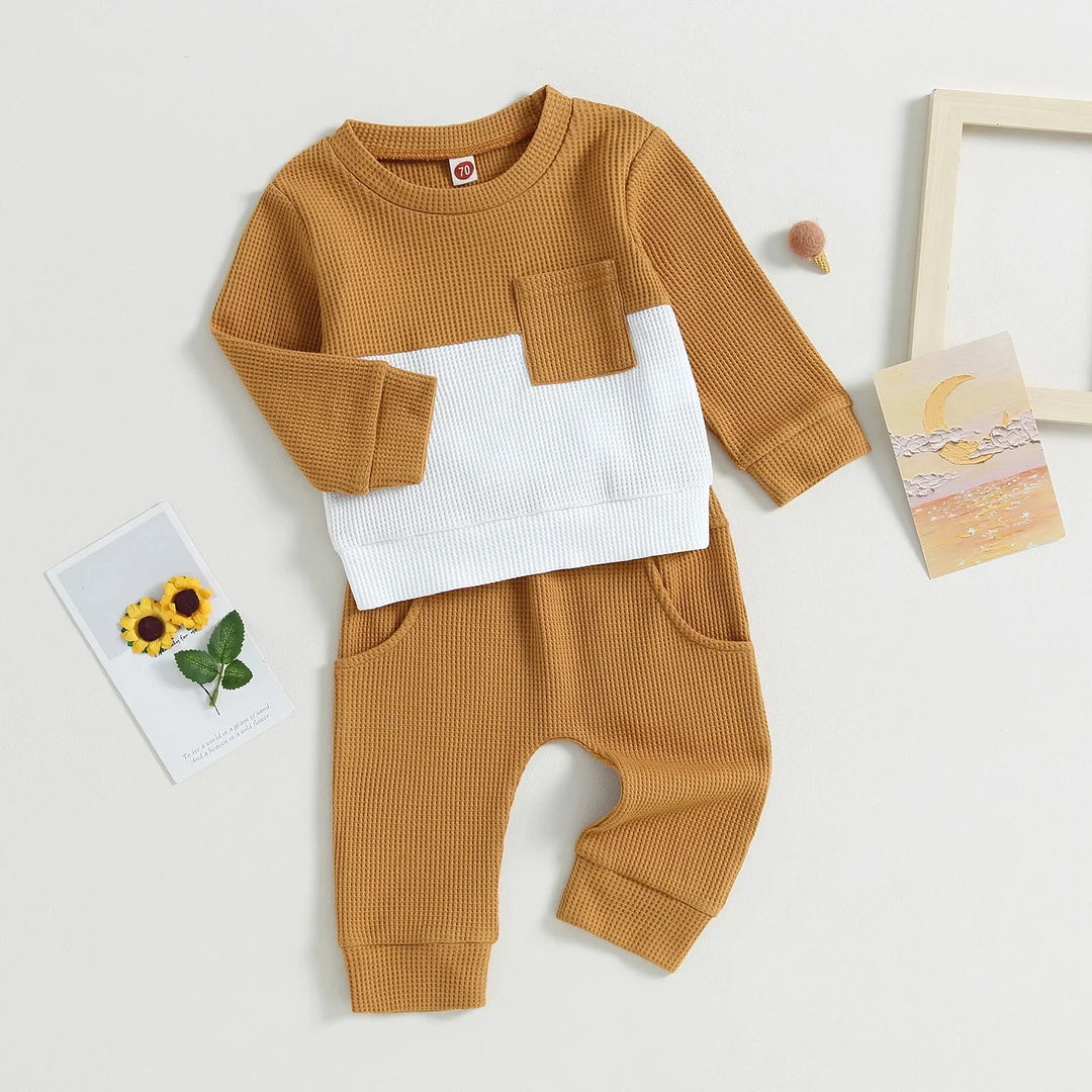 Colorblock waffle knit baby outfit set with mustard yellow pants and matching long-sleeve top with white panel
