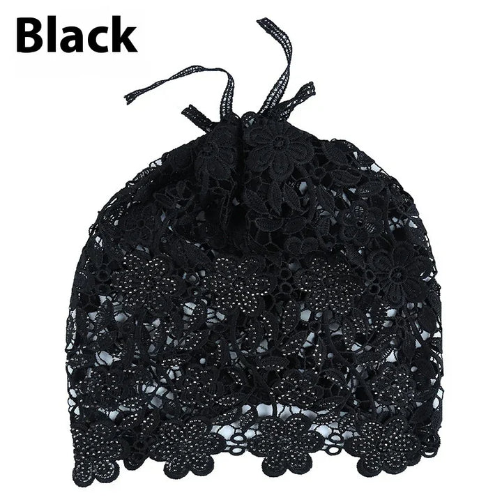 Black floral lace drawstring bag with scalloped edges on white background