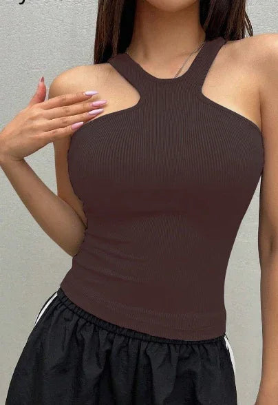 Woman wearing a sleeveless brown ribbed halter top paired with black elastic waist pants