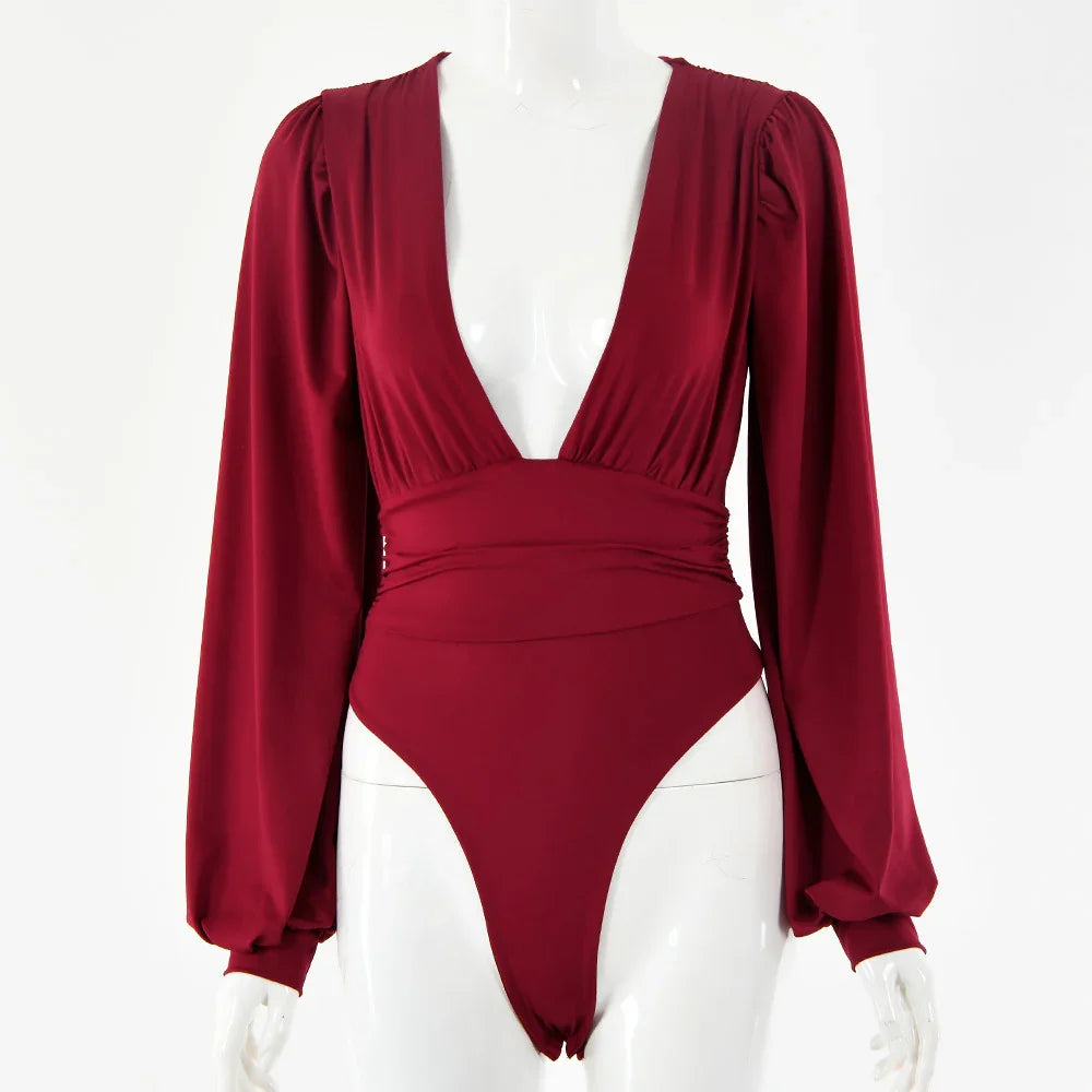 Burgundy long sleeve bodysuit with deep V neckline on white mannequin