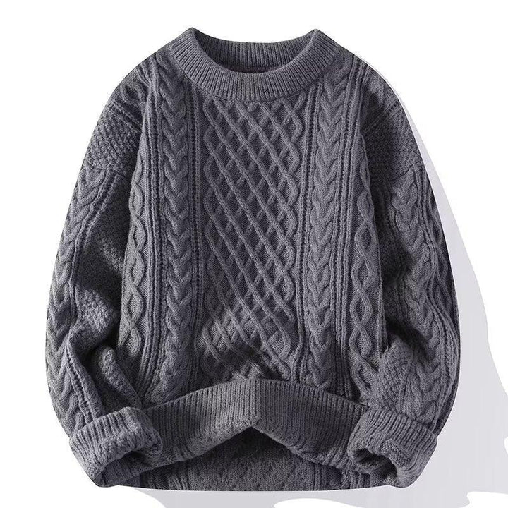 Dark gray cable knit wool sweater with round neckline and textured braided patterns