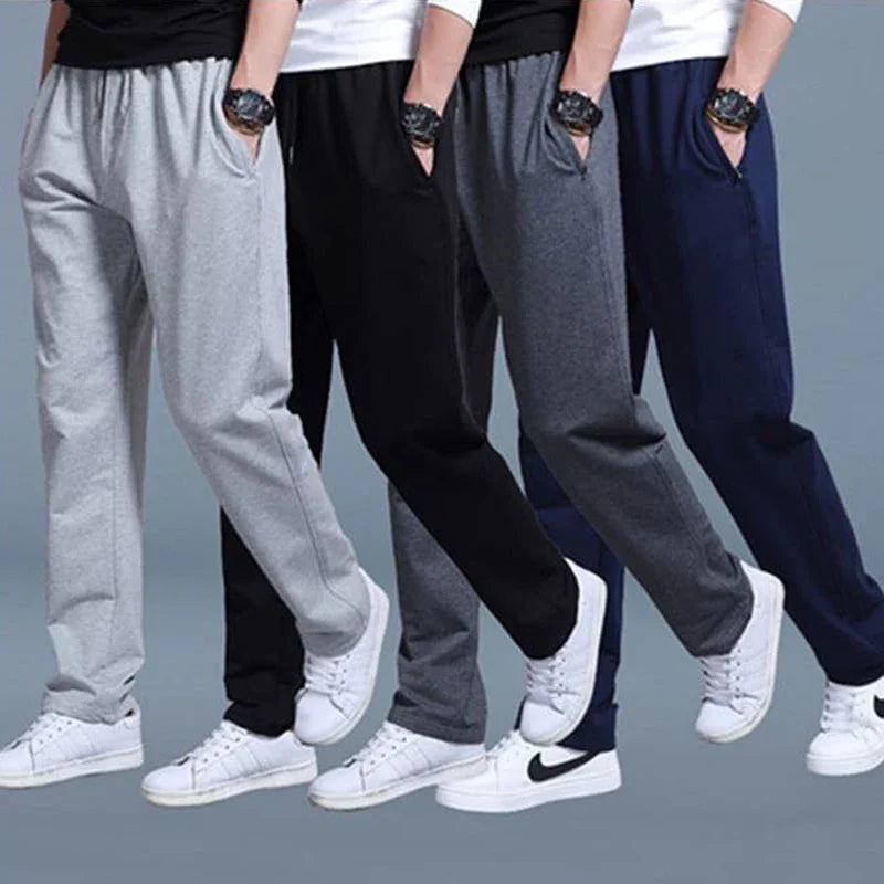 Men's casual sweatpants in gray, black, dark gray, and navy blue paired with white sneakers and black or white tops