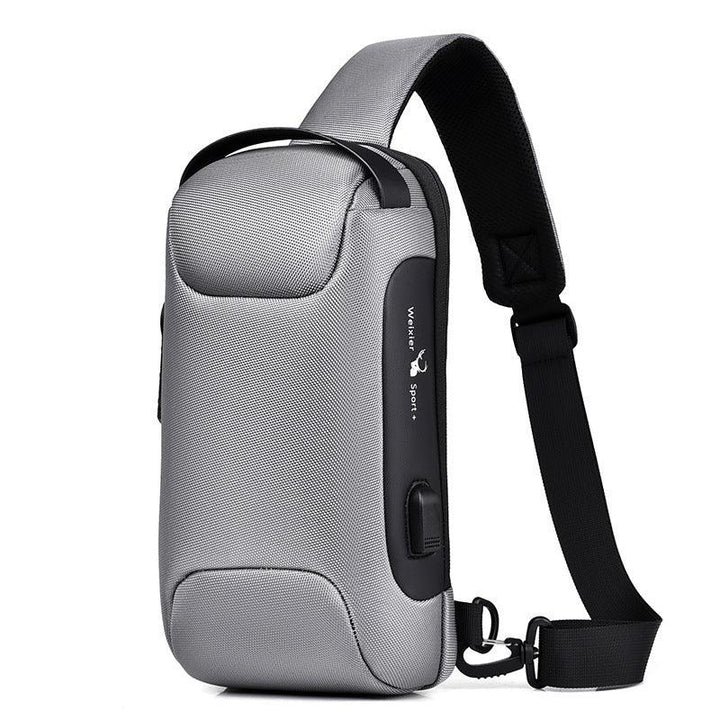 Compact gray crossbody sling bag with black strap and USB charging port, modern casual design
