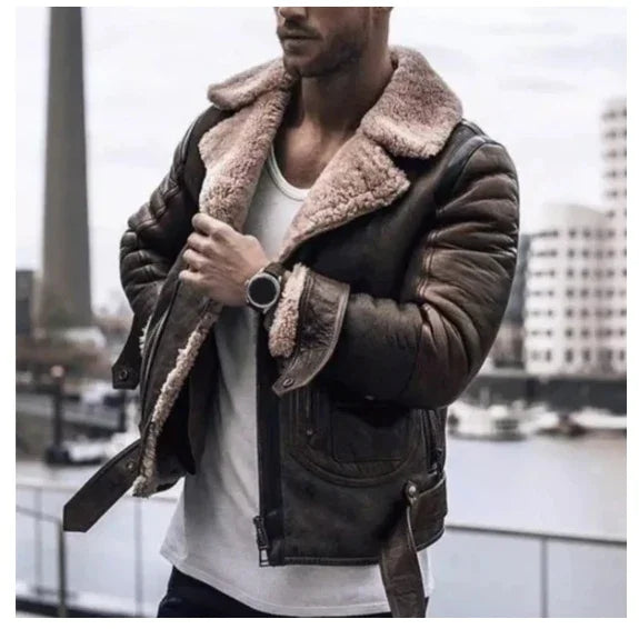 man wearing brown shearling leather jacket with white shirt in urban outdoor setting