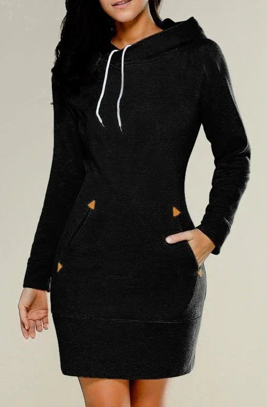 Woman wearing black long-sleeve hoodie dress with white drawstrings and front pockets