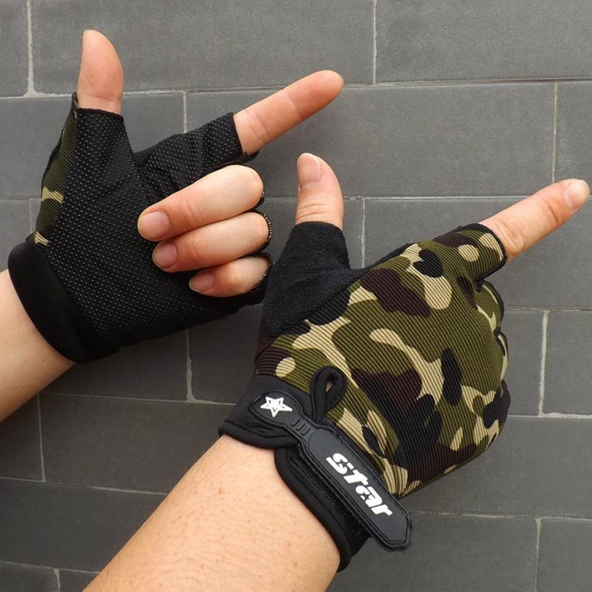 Hands wearing camouflage fingerless cycling gloves against gray tile wall