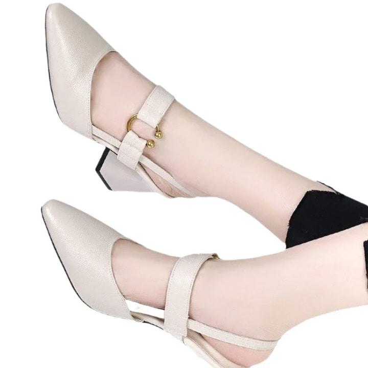 women's beige pointed toe low block heel shoes with ankle strap and gold buckle
