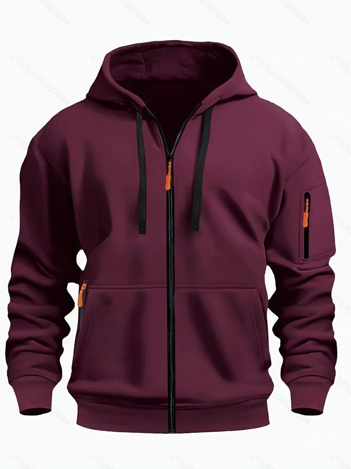 Maroon zip-up hoodie with black drawstrings, orange zipper pulls, and a zippered arm pocket