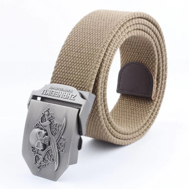 Beige canvas belt with metal skull and crossed swords buckle and dark brown leather accent