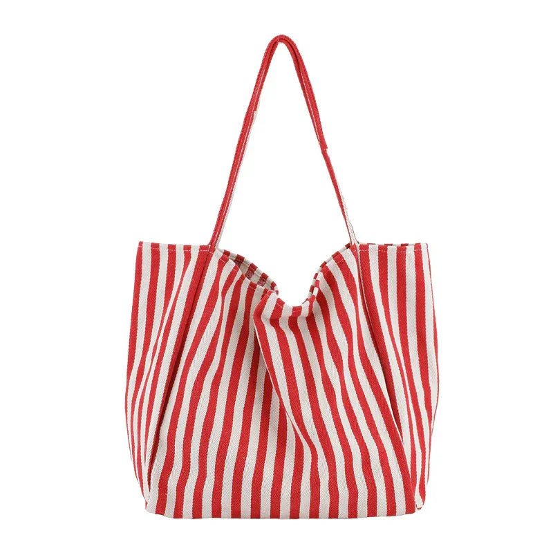 Red and white striped fabric tote bag with long handles on white background