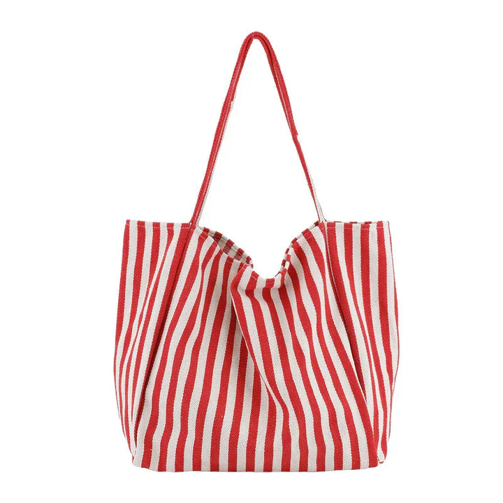Red and white striped fabric tote bag with long handles on white background