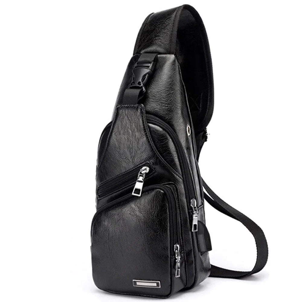 Black leather sling bag with multiple zippered compartments and adjustable strap