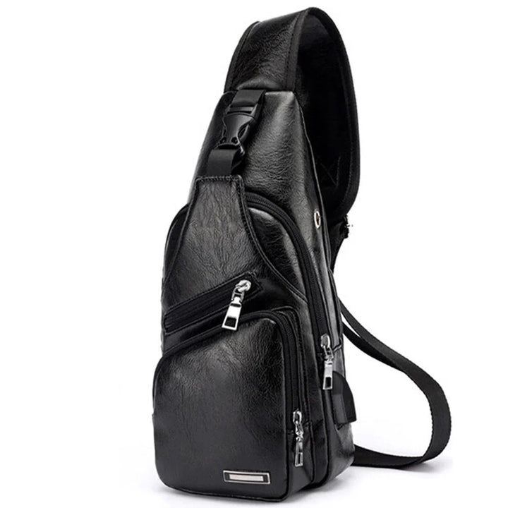 Black leather sling bag with multiple zippered compartments and adjustable strap