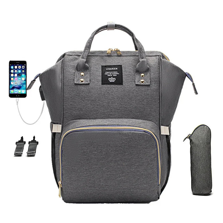 Grey multifunctional backpack with front zip pocket, USB charging port, stroller straps, and matching insulated bottle holder