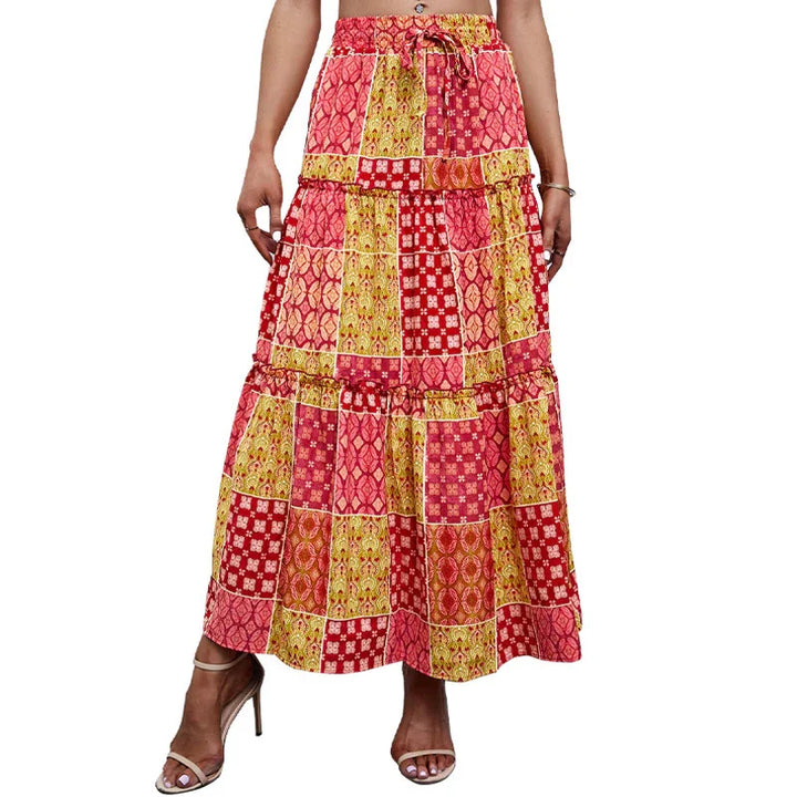 Women wearing multicolor patchwork print boho midi skirt with ruffle tiers and drawstring waist