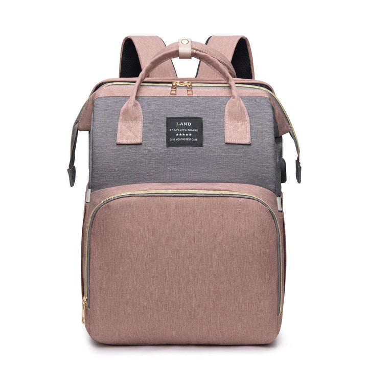 Pink and gray travel backpack with dual handles, front zip pocket, and black label