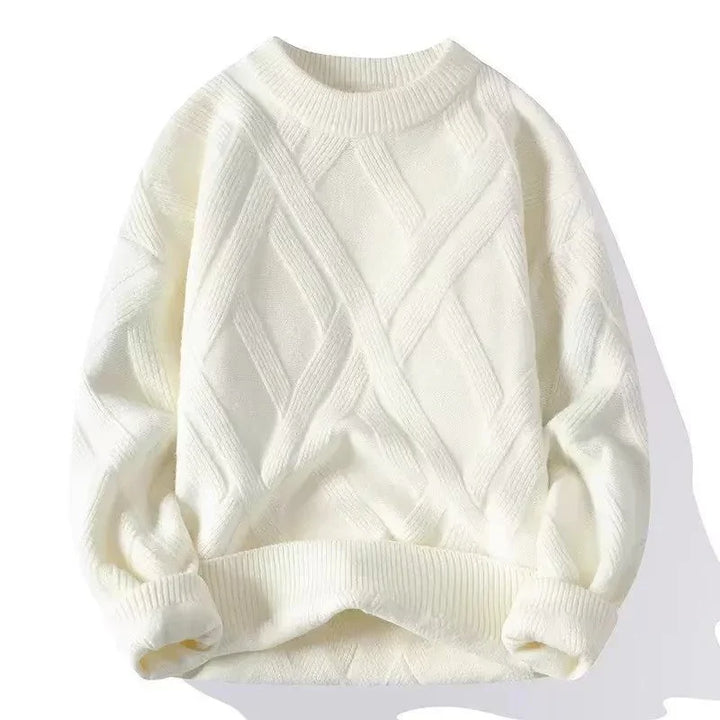 Cozy white cable knit sweater with long sleeves and ribbed cuffs and hem on white background